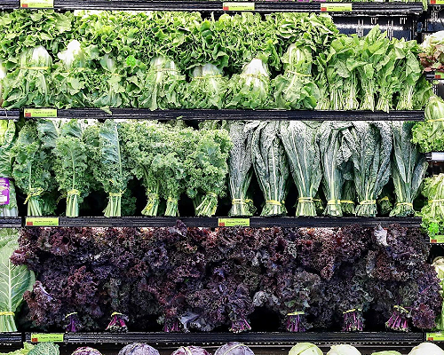 various types of lettuce in a Whole Foods Market produce section