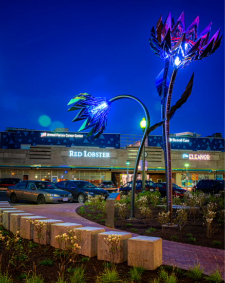 Blumen Lumen exterior flower sculpture at night in Downtown Silver Spring